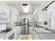 Modern kitchen with stainless steel appliances and granite countertops at 4900 Brittany S Dr # 314, St Petersburg, FL 33715