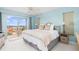 Inviting bedroom with a comfortable bed, soft colors, and a sliding door to the balcony at 4900 Brittany S Dr # 314, St Petersburg, FL 33715