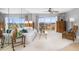 Living room with large windows and water view at 4900 Brittany S Dr # 314, St Petersburg, FL 33715