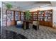 Community library with floor to ceiling bookshelves and cozy chairs for reading at 4900 Brittany S Dr # 314, St Petersburg, FL 33715