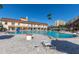 Community pool with ample deck space and lounge chairs at 4900 Brittany S Dr # 314, St Petersburg, FL 33715