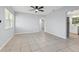 Spacious living room featuring tile floors and ceiling fan at 5019 Jersey S Ave, Gulfport, FL 33707