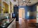 Kitchen with yellow cabinets and metal tile backsplash at 5211 25Th S Ave, Gulfport, FL 33707