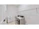 Laundry room with washer, dryer, and cabinets at 5307 Wishing Arch Dr, Apollo Beach, FL 33572