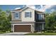 Two story home with brown garage door and gray siding at 759 Steel Dr, Apollo Beach, FL 33572