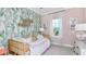 Bright and cheerful bedroom with a cactus themed wall at 759 Steel Dr, Apollo Beach, FL 33572