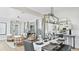 Open concept dining room with a view into the living area at 759 Steel Dr, Apollo Beach, FL 33572