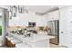 Modern kitchen with white cabinets and granite countertop at 759 Steel Dr, Apollo Beach, FL 33572