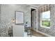 Home office with stylish wallpaper and built-in desk at 759 Steel Dr, Apollo Beach, FL 33572