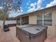 Hot tub with covered patio and view of backyard at 8518 Tidal Breeze Dr, Riverview, FL 33569