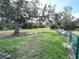 Fenced dog park with benches and mature shade trees at 8519 Sunshower Pl, Parrish, FL 34219