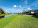 Spacious backyard with pond view and lush grass at 8519 Sunshower Pl, Parrish, FL 34219