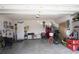 Attached garage with storage shelving and plenty of space for vehicles at 8519 Sunshower Pl, Parrish, FL 34219