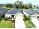 Aerial view of two-story house with landscaped yard at 8519 Sunshower Pl, Parrish, FL 34219