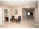 Bright entryway with tile flooring and view into living room at 8519 Sunshower Pl, Parrish, FL 34219