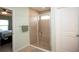 Large walk-in shower with tiled walls and a built-in bench at 8519 Sunshower Pl, Parrish, FL 34219