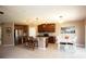 Open kitchen with stainless steel appliances and an island at 8519 Sunshower Pl, Parrish, FL 34219