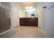 Double vanity bathroom with a large mirror and a spacious shower at 8519 Sunshower Pl, Parrish, FL 34219