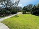 Landscaped walking path meandering through lush greenery at 8519 Sunshower Pl, Parrish, FL 34219