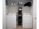 Convenient laundry room with washer, dryer, and ample storage at 8519 Sunshower Pl, Parrish, FL 34219