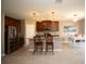 Open kitchen with stainless steel appliances and an island at 8519 Sunshower Pl, Parrish, FL 34219