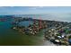 Stunning aerial view of waterfront property with boat dock in a coastal community near the beach, perfect for boating enthusiasts at 15918 Redington Dr, Redington Beach, FL 33708