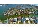 Waterfront home with boat dock on a canal leading to the open bay with a beautiful view of the city skyline at 15918 Redington Dr, Redington Beach, FL 33708