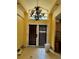 Foyer features double entry doors and high ceilings at 15918 Redington Dr, Redington Beach, FL 33708