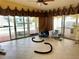 Open living area with sliding glass doors overlooking a waterfront canal view at 15918 Redington Dr, Redington Beach, FL 33708