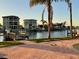 Waterfront backyard with dock, brick patio, and stunning water views at 15918 Redington Dr, Redington Beach, FL 33708