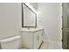 Stylish bathroom features a double sink vanity with elegant fixtures and a modern design at 18096 Foxtail Loop, Venice, FL 34293
