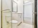 This bathroom features a glass enclosed shower, modern vanity, and contemporary fixtures at 18096 Foxtail Loop, Venice, FL 34293