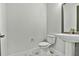 Stylish half-bath with modern toilet and decorative tile floor at 18096 Foxtail Loop, Venice, FL 34293