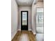 Hallway with beautiful wood floors and a view of the lake at 18096 Foxtail Loop, Venice, FL 34293