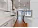 Spacious kitchen with white cabinets, stainless steel appliances, and a large island at 18096 Foxtail Loop, Venice, FL 34293
