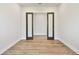 Clean and modern office space with hardwood floors and glass paneled doors at 18096 Foxtail Loop, Venice, FL 34293