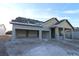 New construction home exterior view, showing garage and front porch at 18128 Foxtail Loop, Venice, FL 34293