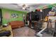 Living room with brown couch, piano, and musical instruments at 1840 21St N Ave, St Petersburg, FL 33713