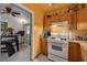 Bright kitchen features wood cabinets, stove, and access to dining area at 1840 21St N Ave, St Petersburg, FL 33713