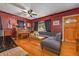 Living room featuring hardwood floors, gray sectional sofa, and a ceiling fan at 1840 21St N Ave, St Petersburg, FL 33713
