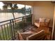 Relaxing balcony with lake view and seating at 29254 Bay Hollow Dr # 3262, Wesley Chapel, FL 33543