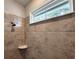 Shower with tiled walls and neutral tones at 3033 54Th N Ave, St Petersburg, FL 33714