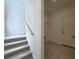 Modern staircase with carpet runner and closet at 3033 54Th N Ave, St Petersburg, FL 33714