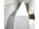 Modern carpeted staircase with white railings at 3033 54Th N Ave, St Petersburg, FL 33714