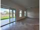 Spacious Gathering room featuring tile and carpeted floors with access to backyard at 3033 54Th N Ave, St Petersburg, FL 33714