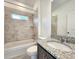 Bathroom with shower/tub combo, granite vanity, and tile flooring at 3033 54Th N Ave, St Petersburg, FL 33714