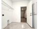 Laundry room with garage access and shelving at 3033 54Th N Ave, St Petersburg, FL 33714