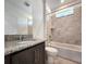Updated bathroom with granite vanity, shower, and bathtub at 3033 54Th N Ave, St Petersburg, FL 33714