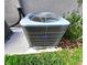 Carrier brand AC unit outside near grassy area at 3033 54Th N Ave, St Petersburg, FL 33714