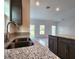 Kitchen with an island, granite countertops, and stainless steel sink at 3033 54Th N Ave, St Petersburg, FL 33714